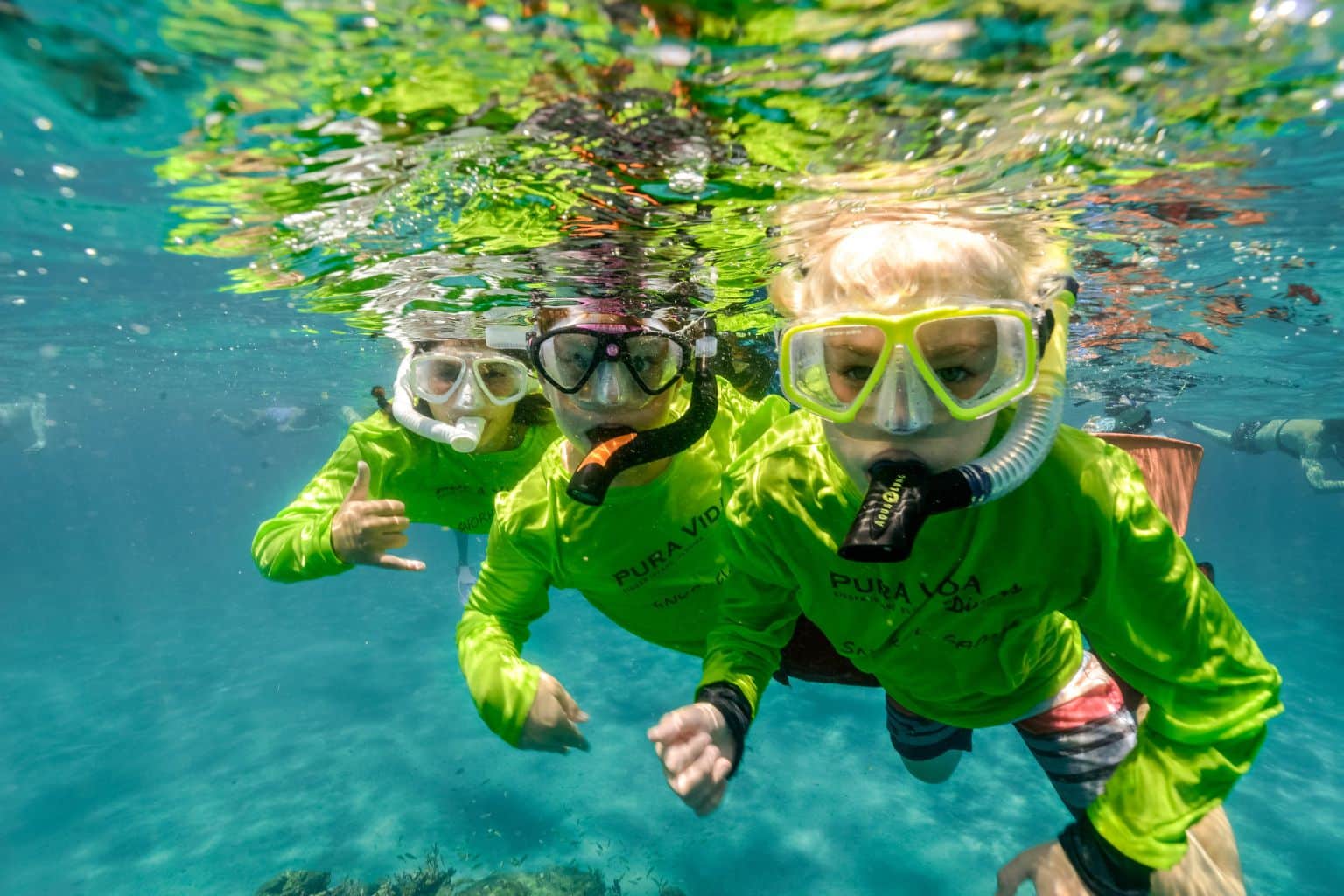 three kids snorkeling at fall snorkel camp
